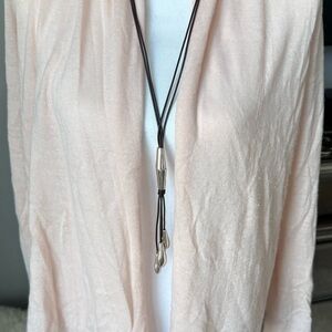 Calypso St. Barth pale peach cashmere sweater.